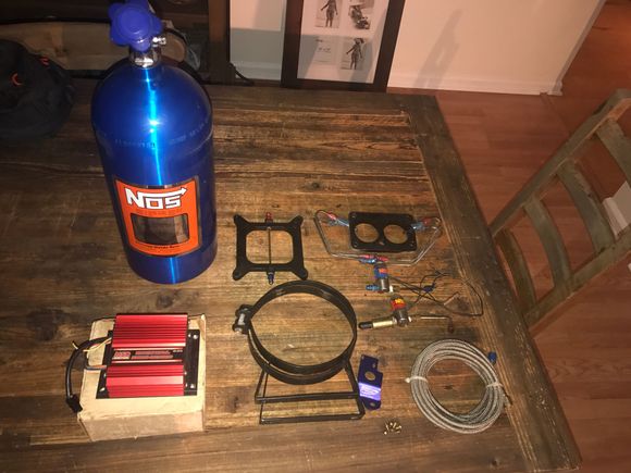 Nitrous kit used on time and got off the car.  100/125/150 jets.  No switch or wires 495 with one plate