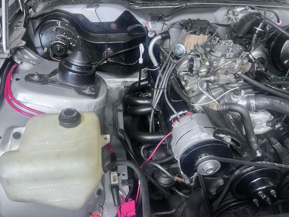 Overdrive Cadillac alternator pulley helps but limits engine rpm, dual 8 gauge power cables going through a pillar, LT1 battery cables.