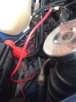 The original alternator wire from the factory harness can be seen.  It runs from the factory black cylinder connector on the bottom and screws into the 2006 Trailblazer harness.