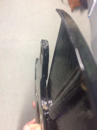 slight jog in the caliper mounting bracket facing away from lip.