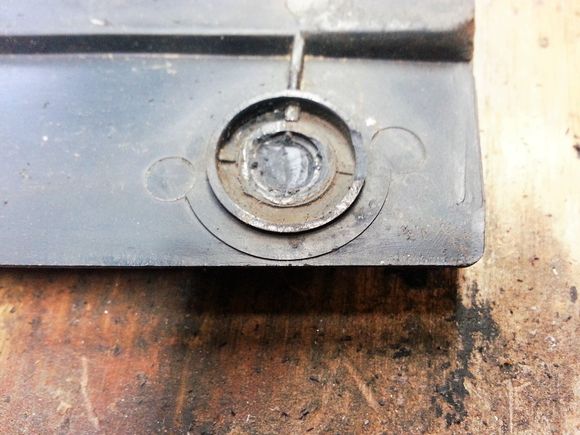 Snapped off the old plastic studs with a pair of needle nose and ground everything smooth with a die grinder and a carbide bit.