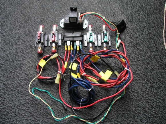 Wiring relays I put together to run the mark 8 fan. 10 relays 1 70 amps and 1 80 amps, 2 fuse breakers for high and low speed, 1 Derale adjustable fan temp control. The low speed fan kicks in at 185 if the temp go's pass that to 195 I have switch in side when I turn it on it kick's of the low speed relay when the high speed relay kicks in.