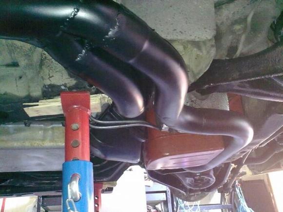 After modifying, very close fit to; between crossmember and oil pan, and the front sub frame.