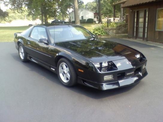 This is my 1991 Camaro RS v8 305 TBI with M5 transmission.  This car is 21 Years old and absolutely beautiful.  Aside from the custom bumper (since PA doesn't require a front plate) What you see on this car is what was ordered from the factory.  z28 wheels were a factory option for the RS; who knew?  I am the second owner of this wonderful north eastern survivor.  Believe it or not, this is a PA car.