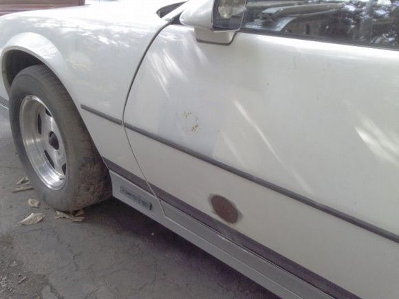sanded rust spot on the driver side door