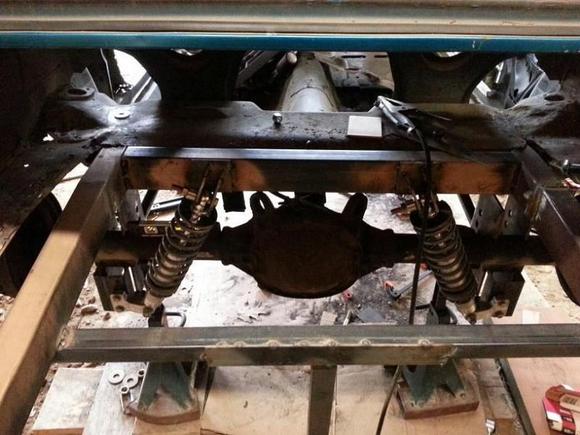 Custom narrowed 2x3 frame rails, custom triangulated 4 link, coil overs