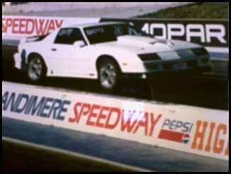 My car at the same track after some body work, tourque thrust 18 inch wheels, and a big block hood. Running low 14's with original motor.
