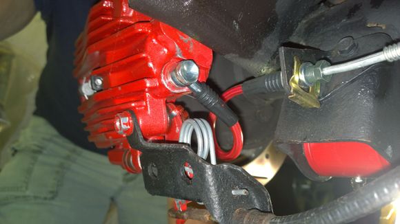 The wire end fits through the bracket hole perfectly.