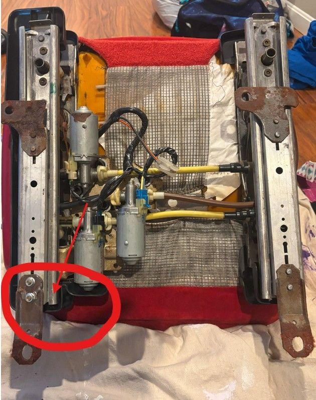 Front of the seat is toward the bottom of the picture.  Circled area is area near where it cracked. (door side of drivers seat)