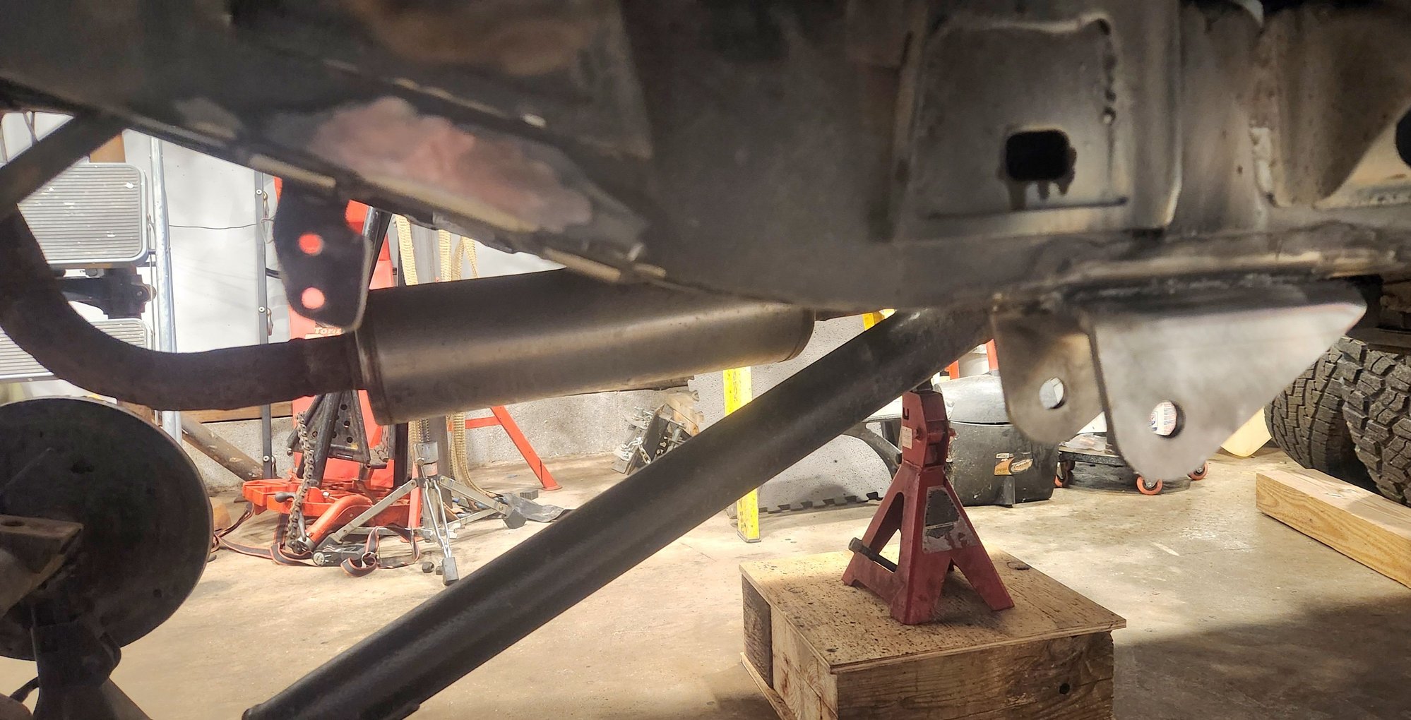 On the passenger side i left a small part of the spring mount. This is to still use the parking brake cable mount in its original location. I don't anticipate it being an issue on clearance.