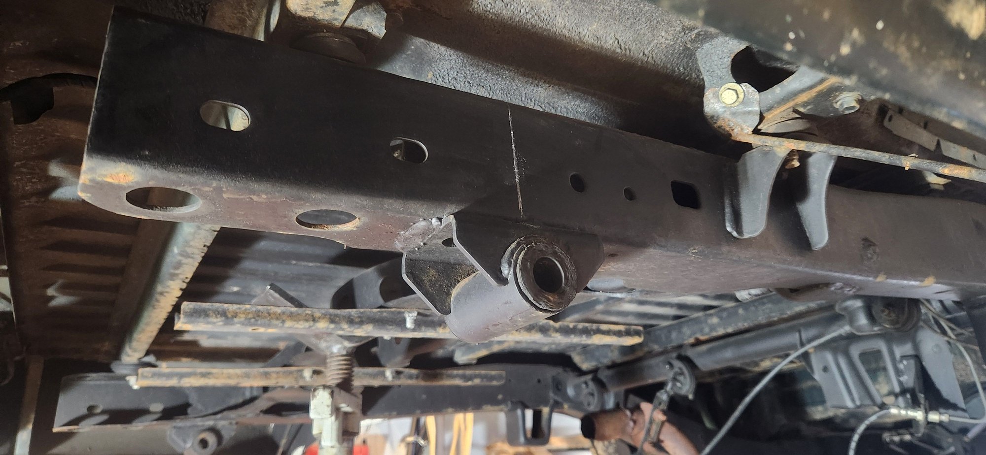 I didnt anticipate needing it but i precautionary marked center of the rear shackle mounts before cutting them off.