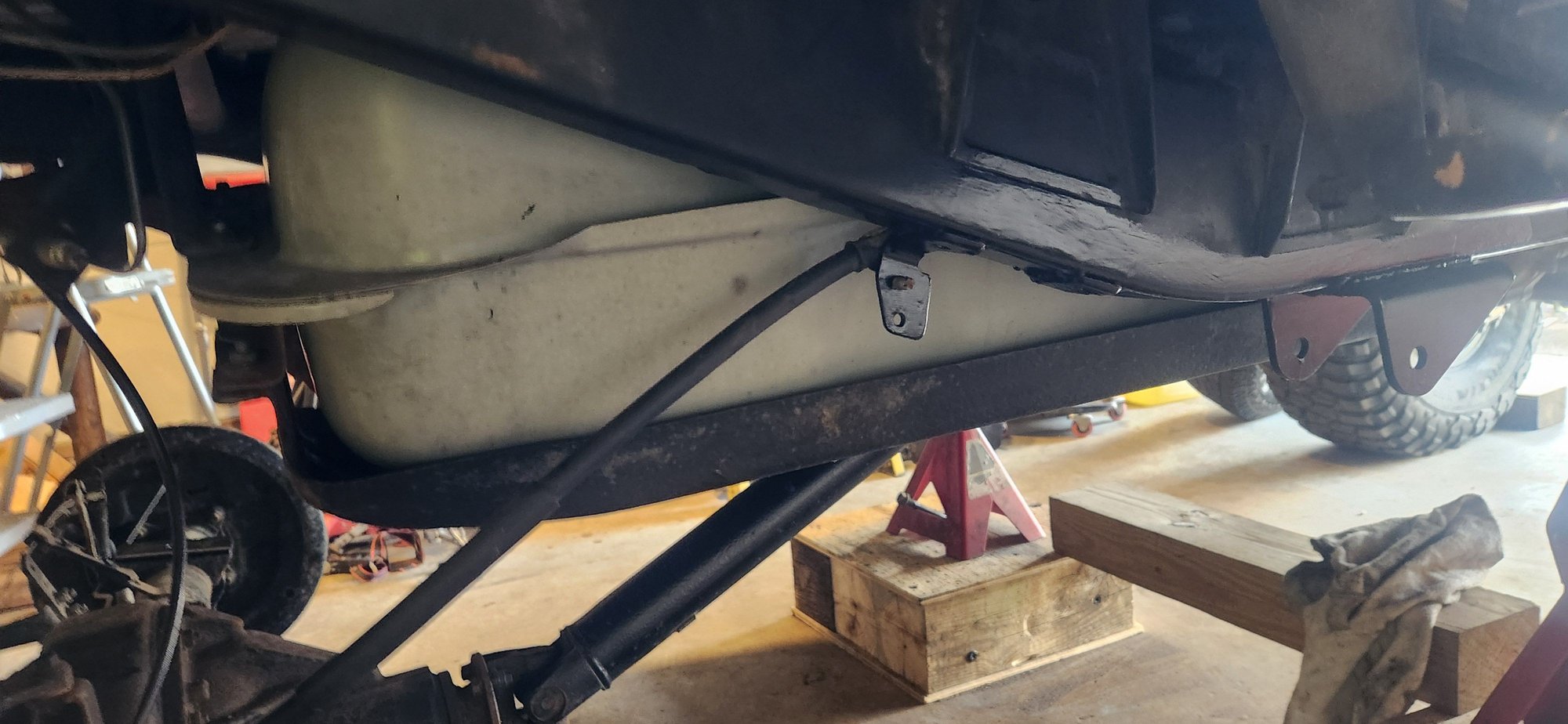 Fuel tank skid plate. Before bolting this back up i gave it a generous coating of fluid film on the inside to help with rust. Wasn't bad jist a preemptive.
