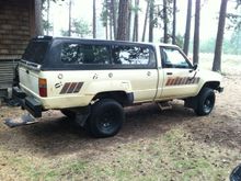 hit the junkyard and scored a somewhat color matched (rattle can maybe) tail gate from a 2wd with a jap bed.  It fits decent and i kind of like the jap roll to the outside for the tailgate.  semi useful and helps with water run off from the topper. Also scored all the light covers i need to get legal.  OEM baby!