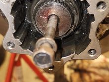 Using any toyota 12mm bolt you can thread it into the end ove axle. This give you something to grab and pull the axle through just enough to reinsert your split ring.