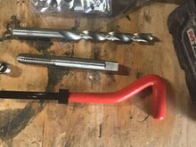 Drill bit, tap, helicoils, and install tool kit. 