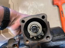 Grease the teeth on the power piston and sector shaft and where the seal rides on the shaft. Now center the sector shaft teeth and drop it in.
Turn the box upside down and allow its own weight to push it in.