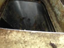 with the camera jammed down the access hole I cut, you can see the fresh air intake box sides that are INSIDE the fire wall
