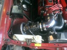 simple 90 degree 3" spectre elbow from Pep boys and extended MAF / AFM wiring to that location.