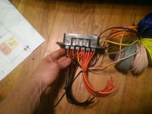 Red 12ga will go to a + busbar and leads into the fuses, then to the relays.  Black (with red stripe) 12ga will go to a grounding busbar.  Colorful spools will be run through the firewall to the switches with other wiring going to the interior.