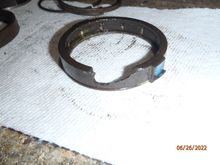 this is what happens to the plastic/bakelite brake spring cover if you aren't careful when prying the assembly up out of the lock plate.