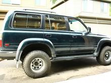 My car after the new struts and 32x12.5r15's are put on (and the back brakes are ground to clear the rims).