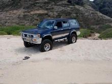 Sittin pretty in the sand - beach near the middle of the trail... BAD idea to sit in the sand, fully inflated tires...no winch or tow rope and SOFT sand...