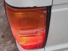 Driver side. When the tail light is lit, no bleed through into reverse reflector
