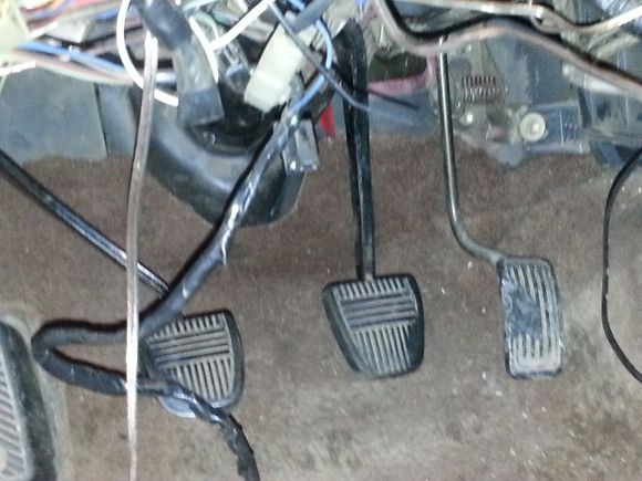 adding a clutch pedal. this was interesting. the automatic pedal assembly had the hanger spot for a clutch pedal and was near identical to the manual one.