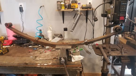 While that paint was curing i went through these used 3inch trail gear springs i picked up. I would like to lower the runner overall slightly. So i picked up a low profile front spring hanger as well.
 The leaf springs i pulled apart, put new pads between the leafs and a light coating of greas all over to help them resettle with out making a bunch of racket