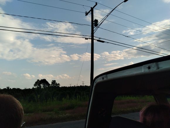 One side of the road.