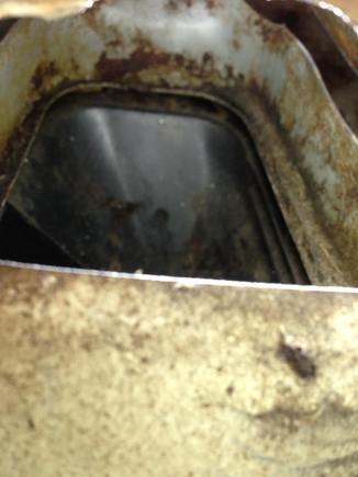 with the camera jammed down the access hole I cut, you can see the fresh air intake box sides that are INSIDE the fire wall