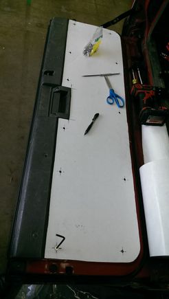 rear cardboard template for the tailgate (already soundproofed)  not 100% sure whether I want to cover the top plastic portion in neoprene, or if I should shoot it with bedliner (UPOL Raptor) as it's an odd shape that may be difficult to cover and in a spot that it'll take some abuse