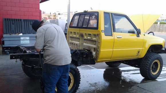 cleaning the frame after removing the old bed. the bed's are only held on by 6 body bolts, fuel filler neck and tail light wiring. super easy to remove, not very heavy 2 people can easily remove, just an awkward size.