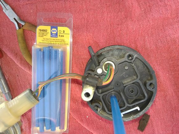 Here we check the valves with a bit of straw, hose, or in this case some shrink-wrap (Napa part number shown)