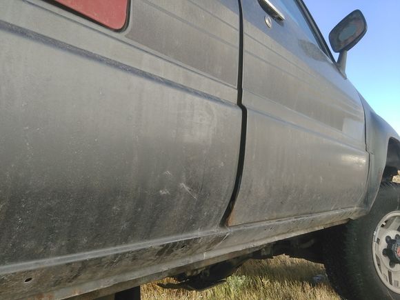 Looks like the cab is tweaked maybe. Door pops open when the latch is released.