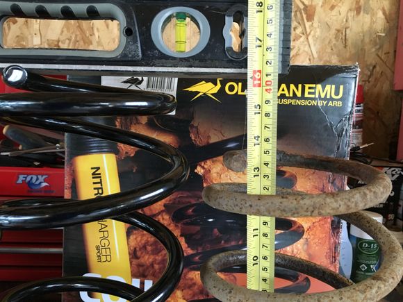 13 5/8" on fatigued factory rear spring w/o load.  OME non-fatigued #990 spring measures 16".  That is at LEAST 2.5 to 3" difference.