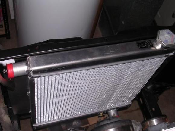I used a BE COOL aluminum radiator from jegs that can cool a v8 specifically for a toy to chev conversion and mounts in factory location