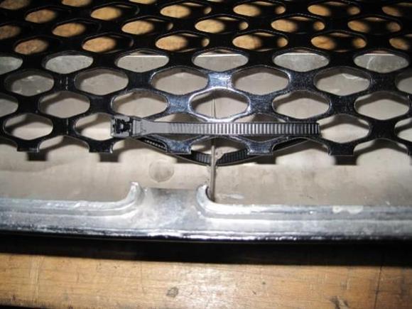 Zip tie mesh to grill