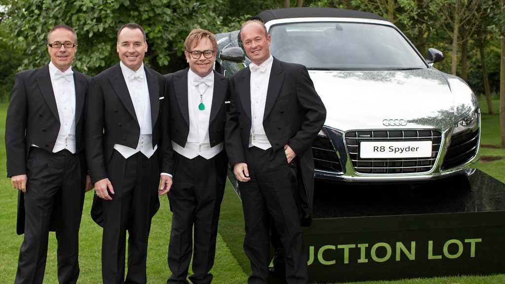 Elton John with friends and the chrome Audi R8 Spyder