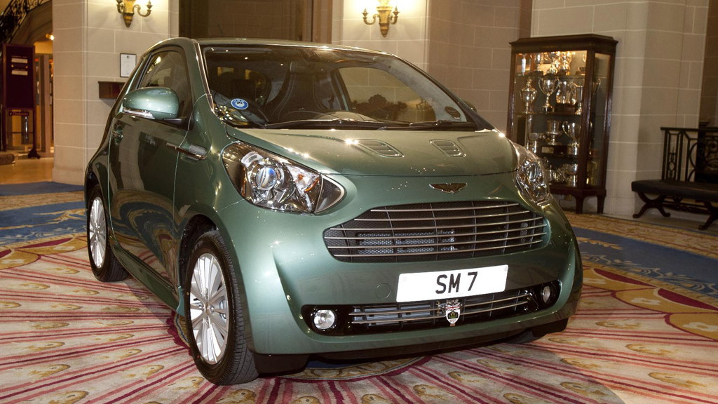 Sir Stirling Moss and his new Aston Martin Cygnet