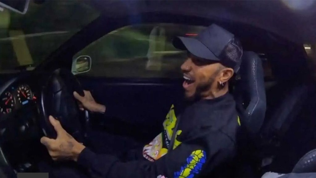 Lewis Hamilton driving an R34 Nissan Skyline GT-R