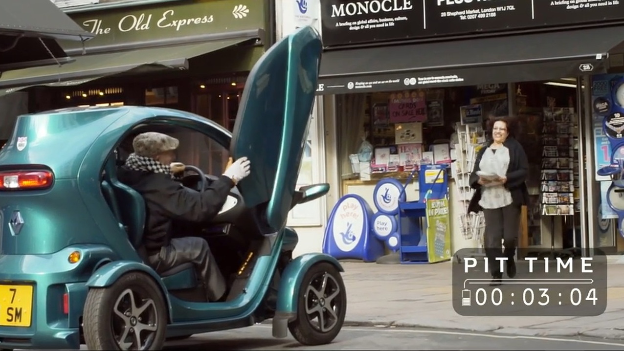 Sir Stirling Moss in his Renault Twizy electric car, London, May 2015