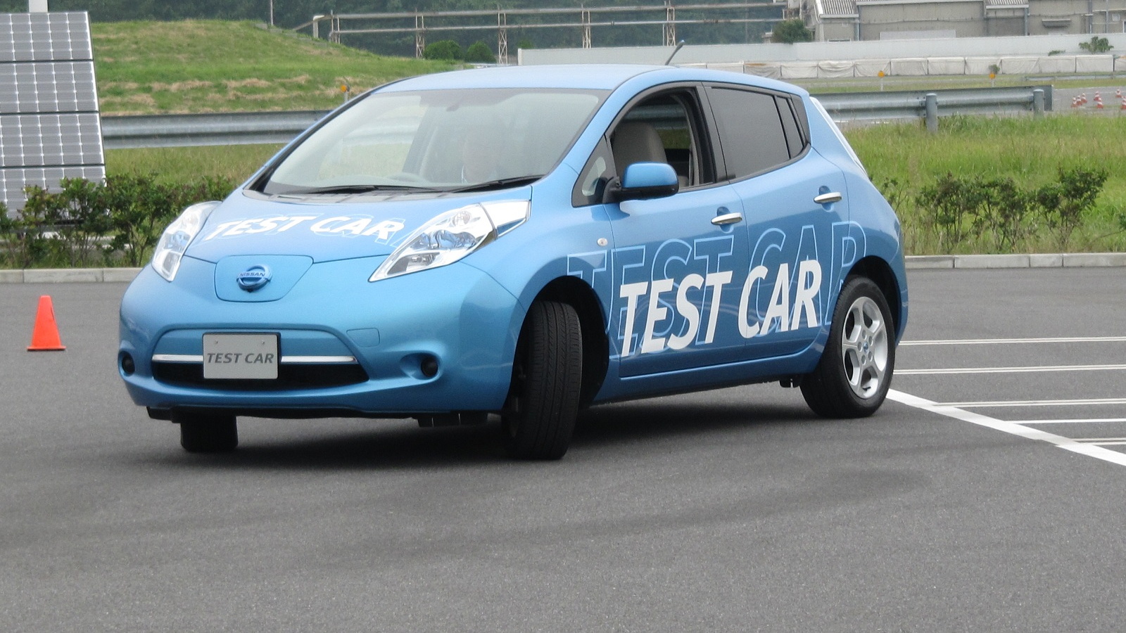 Nissan Leaf with automatic parking location to position over a wireless charging pad, Oppama, Japan