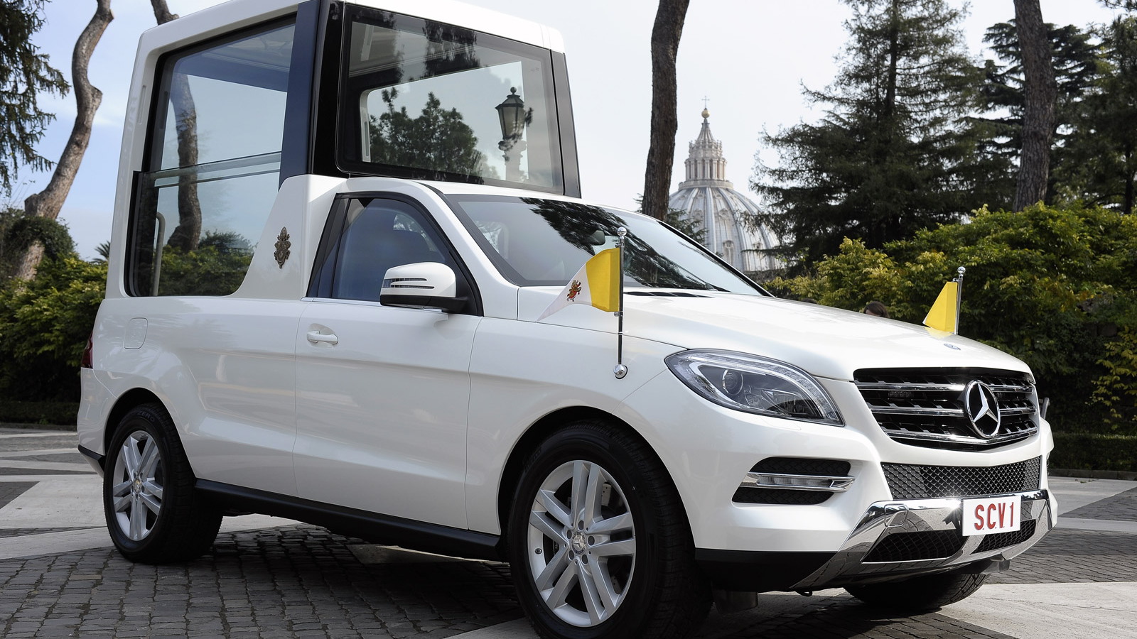 Pope Francis handed the keys to the Popemobile by Daimler CEO Dr. Dieter Zetsche