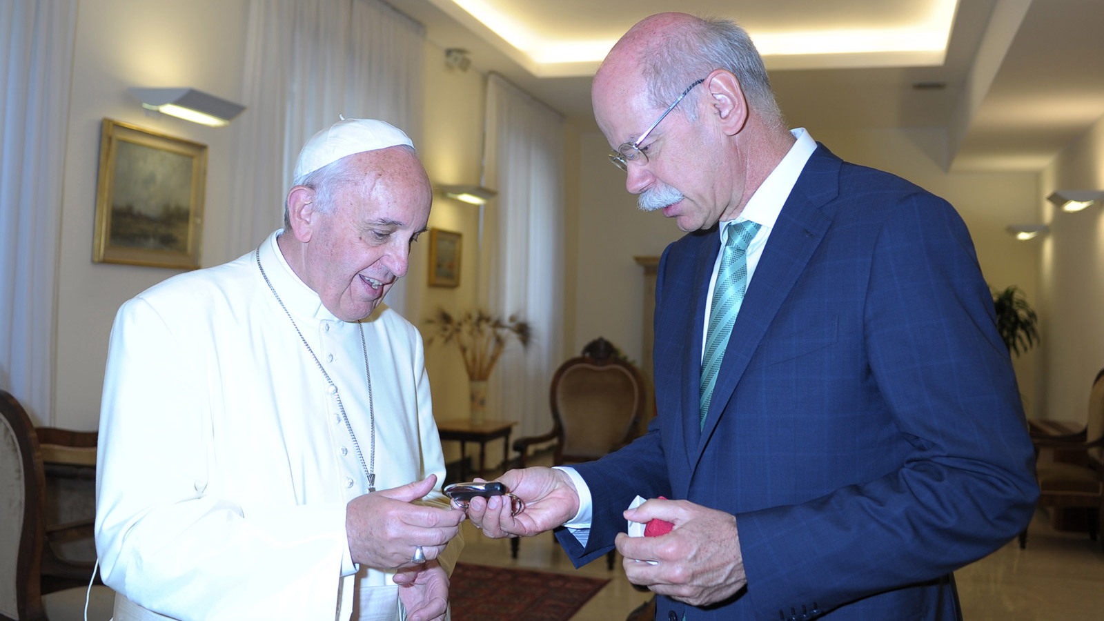 Pope Francis handed the keys to the Popemobile by Daimler CEO Dr. Dieter Zetsche