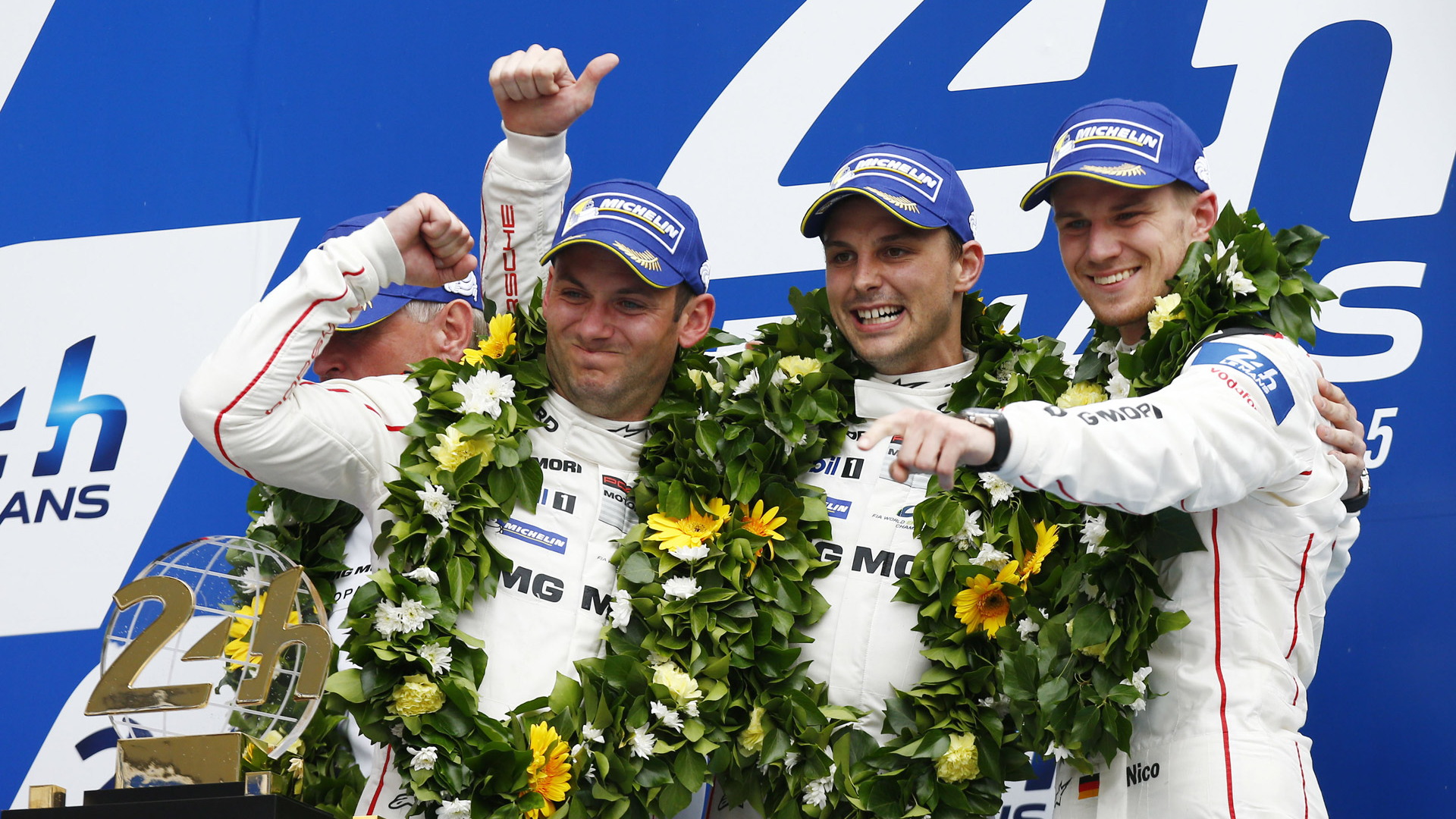 From left to right: Nick Tandy, Earl Bamber & Nico Huelkenberg after 2015 24 Hours of Le Mans win