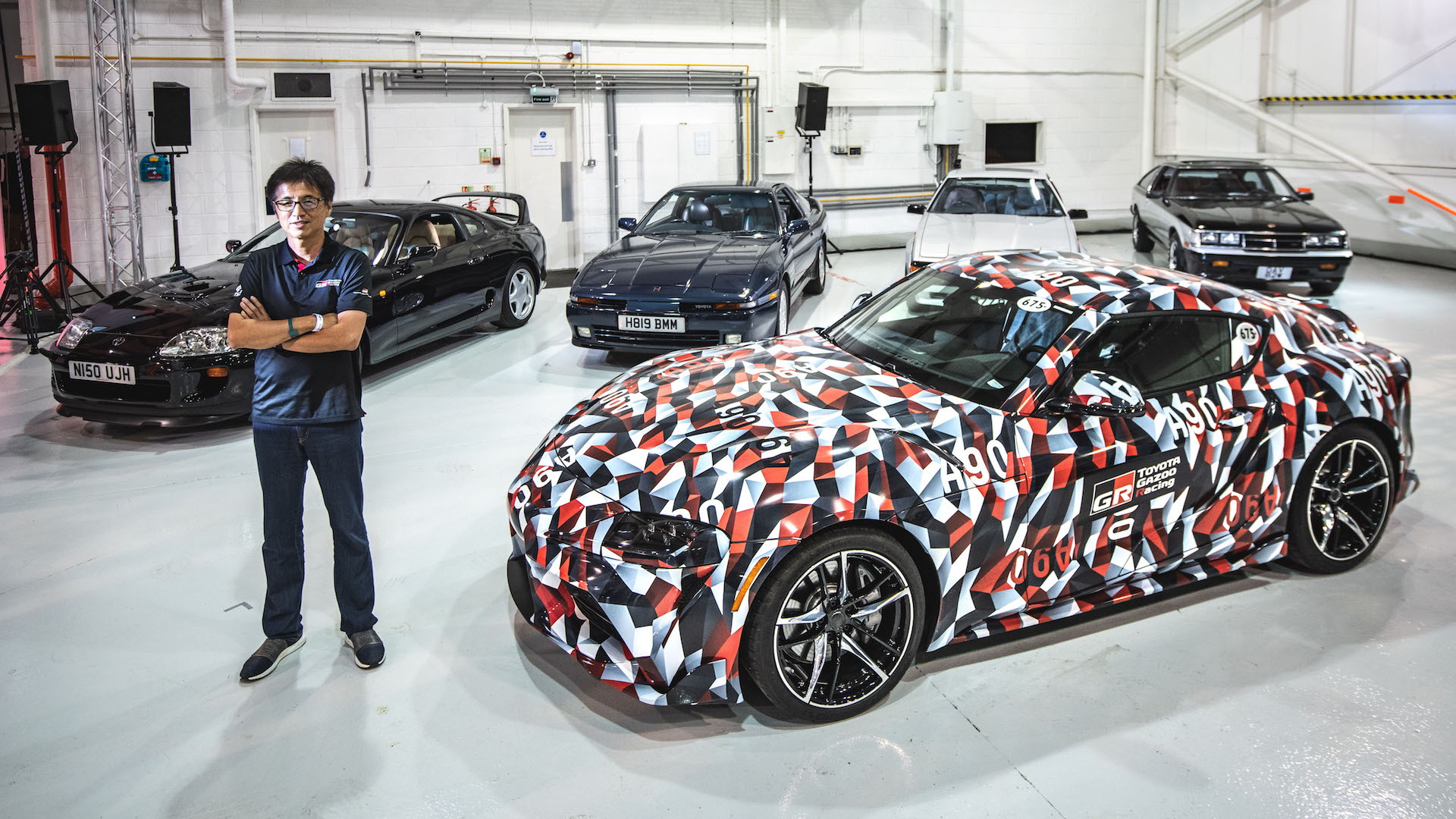 Tetsuya Tada with A90 Toyota Supra and previous four generations