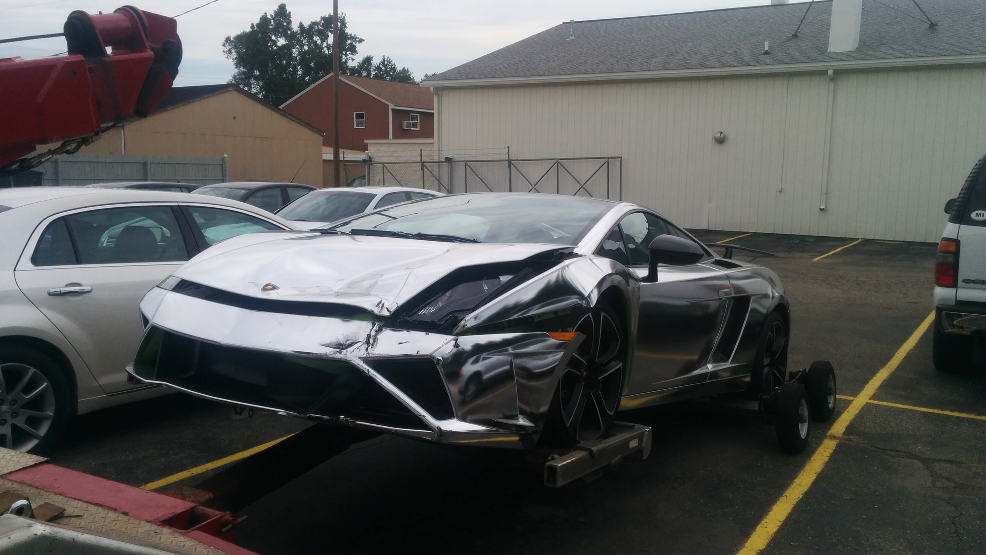 Chrome-wrapped Lamborghini Gallardo crashed in East Lansing, MI. Photos by Sheldon Little. 