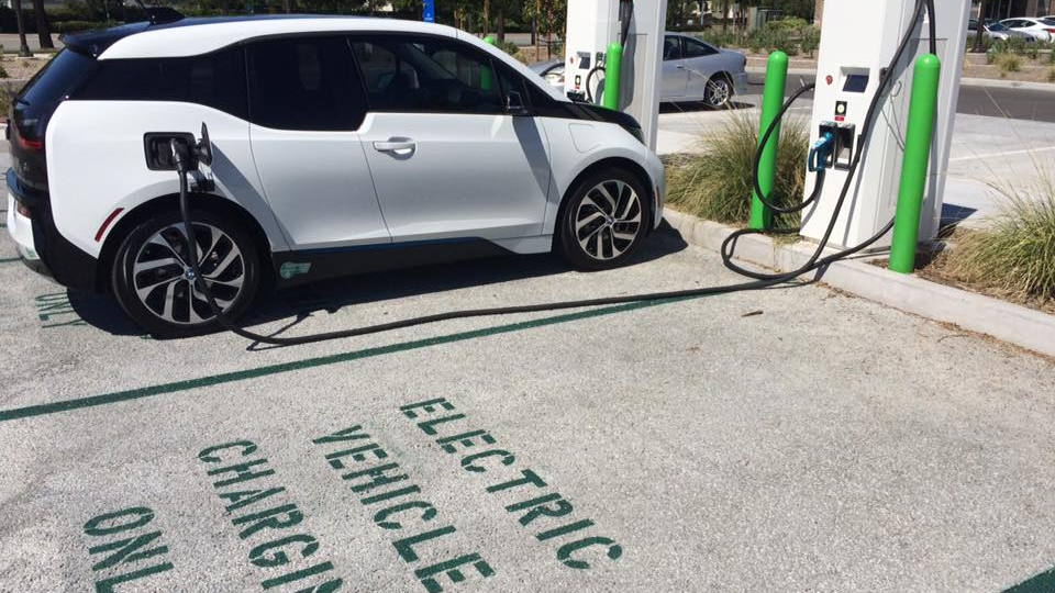 BMW i3 electric car charging in 'EV Charging Only' space, Santa Clarita, CA  [photo: Steve J. Myung]